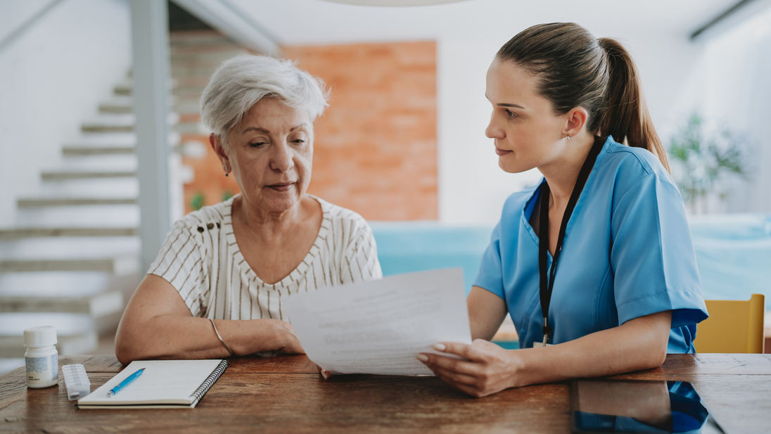 Home care appointment nurse helping with a medication prescription.jpg