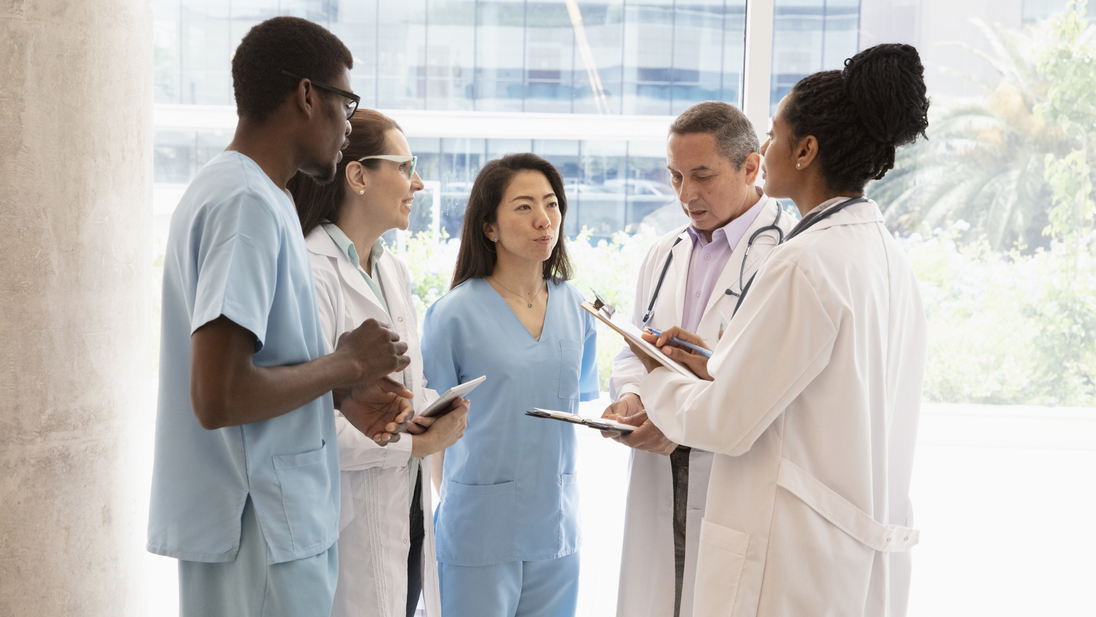 Medical staff talking at hallway.jpg