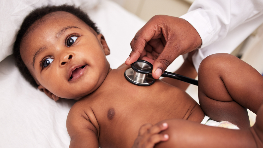 Baby at a checkup with a doctor listening to heartbeat.jpg
