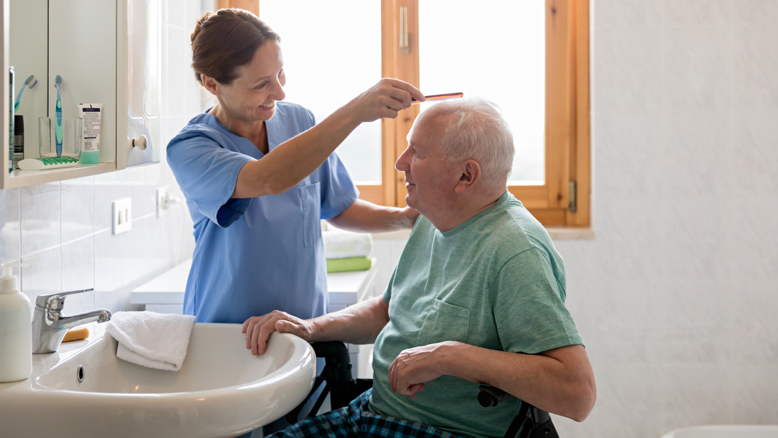 Home caregiver with senior man in bathroom.jpg