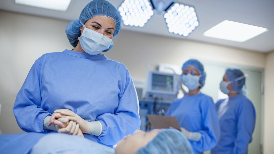 Doctors in operating room wearing protective workwear.jpg
